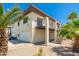Multi-story home featuring a two-car garage and stairs leading to an elevated balcony at 1916 W Morningside Dr # 111, Phoenix, AZ 85023
