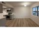 Kitchen and dining area feature wood floors, stainless appliances, and large windows at 1916 W Morningside Dr # 111, Phoenix, AZ 85023