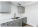 Kitchen featuring gray cabinets, stainless steel appliances, and white countertops at 1916 W Morningside Dr # 111, Phoenix, AZ 85023