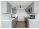 Modern kitchen features gray cabinets, stainless steel appliances, and white countertops at 1916 W Morningside Dr # 111, Phoenix, AZ 85023