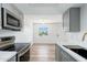 Kitchen features white countertops, gray cabinets, and stainless steel appliances at 1916 W Morningside Dr # 111, Phoenix, AZ 85023