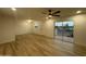 Bright and airy living room with wood floors, ceiling fan, and sliding glass doors at 1916 W Morningside Dr # 111, Phoenix, AZ 85023