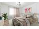 Relaxing primary bedroom with neutral tones, decor, and great natural light at 1916 W Morningside Dr # 111, Phoenix, AZ 85023
