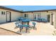 Community outdoor picnic area with blue tables and a building behind at 1916 W Morningside Dr # 111, Phoenix, AZ 85023