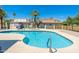 Community swimming pool and jacuzzi surrounded by lounge chairs and palm trees at 1916 W Morningside Dr # 111, Phoenix, AZ 85023