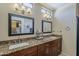 Bathroom featuring double sinks, granite countertops, and a large mirror at 1927 E Ranch Rd, Tempe, AZ 85284