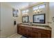 Bathroom featuring double sinks, granite countertops, and a large mirror at 1927 E Ranch Rd, Tempe, AZ 85284