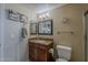 Cozy bathroom featuring granite countertops, vanity, and a mirror at 1927 E Ranch Rd, Tempe, AZ 85284