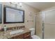 Bathroom features a shower with glass door and granite countertops at 1927 E Ranch Rd, Tempe, AZ 85284