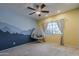 Bright bedroom featuring a mountain mural, ceiling fan, and a cozy hanging chair at 1927 E Ranch Rd, Tempe, AZ 85284
