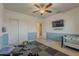 Bedroom featuring a ceiling fan, and excercise equipment set upon a black mat at 1927 E Ranch Rd, Tempe, AZ 85284