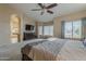 Large bedroom with a ceiling fan, carpet flooring, and neutral colored walls at 1927 E Ranch Rd, Tempe, AZ 85284