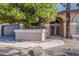 Close up on house entrance featuring an arched entryway and decorative landscaping at 1927 E Ranch Rd, Tempe, AZ 85284