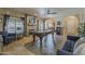 Open game room with large pool table, arched doorways, and plenty of natural light at 1927 E Ranch Rd, Tempe, AZ 85284