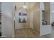 Hallway features tiled flooring, archways, and neutral colored walls at 1927 E Ranch Rd, Tempe, AZ 85284