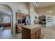 Spacious kitchen with stainless steel appliances, central island, and views into adjacent rooms at 1927 E Ranch Rd, Tempe, AZ 85284