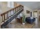 Living room featuring a piano, staircase, couch, and tiled floors at 1927 E Ranch Rd, Tempe, AZ 85284