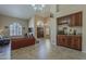 Bright and airy living room featuring a wine bar, tile flooring, and soaring ceilings at 1927 E Ranch Rd, Tempe, AZ 85284