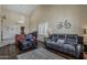 Open living room with high ceilings, tile floors and an entertainment niche with wine storage at 1927 E Ranch Rd, Tempe, AZ 85284