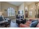 Inviting living room features soaring ceilings, tile entryway, and multiple shuttered windows at 1927 E Ranch Rd, Tempe, AZ 85284