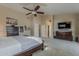 Spacious main bedroom features a ceiling fan, and access to the ensuite bathroom at 1927 E Ranch Rd, Tempe, AZ 85284