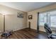 Cozy home office with wood floors, natural light, and decorative accents at 1927 E Ranch Rd, Tempe, AZ 85284