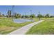 Community park featuring a basketball court, grassy areas, and walking path at 1927 E Ranch Rd, Tempe, AZ 85284