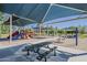 Community playground with shaded picnic tables, slides, and swings for enjoyable outdoor gatherings at 1927 E Ranch Rd, Tempe, AZ 85284