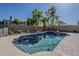 Private backyard swimming pool with waterfall feature surrounded by mature trees at 1927 E Ranch Rd, Tempe, AZ 85284