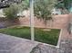 Backyard view featuring artificial turf, pavers, and a privacy wall at 19814 N 49Th Dr, Glendale, AZ 85308