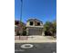 Front exterior view of a two-story home with a two-car garage and a driveway at 19814 N 49Th Dr, Glendale, AZ 85308