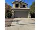Charming two-story home with a tile roof and well-maintained landscaping in a suburban neighborhood at 19814 N 49Th Dr, Glendale, AZ 85308