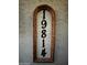 Close-up of decorative house number sign displaying '19814' at 19814 N 49Th Dr, Glendale, AZ 85308