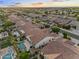 Aerial view of residential neighborhood featuring homes with tile roofs, pools and landscaping at 19905 E Apricot Ln, Queen Creek, AZ 85142