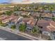 Aerial view of a single-Gathering home with a well-manicured lawn and lush landscaping in a residential neighborhood at 19905 E Apricot Ln, Queen Creek, AZ 85142