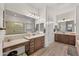 Large primary bathroom with double sinks, large mirrors, and tiled floors at 19905 E Apricot Ln, Queen Creek, AZ 85142