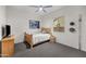 Comfortable bedroom with a ceiling fan and a view of the backyard at 19905 E Apricot Ln, Queen Creek, AZ 85142