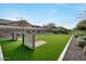 Dog park with fenced in area, trees, and sand pit at 19905 E Apricot Ln, Queen Creek, AZ 85142