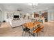 Open-concept floor plan with dining area, living room with built-ins, and eat-in kitchen at 19905 E Apricot Ln, Queen Creek, AZ 85142