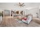 Bright, open-concept floor plan with tile floors and views of kitchen, dining room, and living space at 19905 E Apricot Ln, Queen Creek, AZ 85142