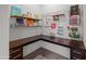 This office area includes lots of counter space, storage, and peg board organizer at 19905 E Apricot Ln, Queen Creek, AZ 85142