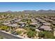Aerial view of a community with houses and desert landscaping at 20121 N 76Th St # 2006, Scottsdale, AZ 85255