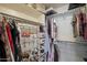 Spacious walk-in closet with ample storage, shelves, and well-organized clothing and accessories at 20121 N 76Th St # 2006, Scottsdale, AZ 85255