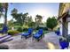 Outdoor patio area with lounge chairs and manicured landscaping and a view of a golf course at 2041 W Hemlock Way, Chandler, AZ 85248