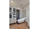 Classic bathroom with a clawfoot tub next to a window and white storage cabinet at 2041 W Hemlock Way, Chandler, AZ 85248