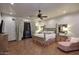 Serene bedroom with french doors, patterned wallpaper, and a four-poster bed at 2041 W Hemlock Way, Chandler, AZ 85248