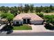 Beautiful single-story home with a well-manicured lawn, desert landscaping and tile roof at 2041 W Hemlock Way, Chandler, AZ 85248