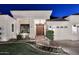 Up close, this is the entrance to a home with a double-door entry, fountain and brick walkway at 2041 W Hemlock Way, Chandler, AZ 85248