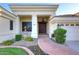 Inviting front entrance with manicured landscaping, decorative fountain, and covered porch at 2041 W Hemlock Way, Chandler, AZ 85248