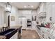Well-appointed kitchen with white cabinetry, patterned backsplash, and professional-grade appliances at 2041 W Hemlock Way, Chandler, AZ 85248